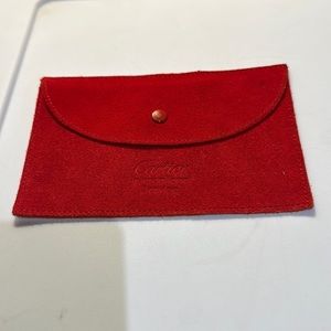 Cartier suede snap jewelry bag.